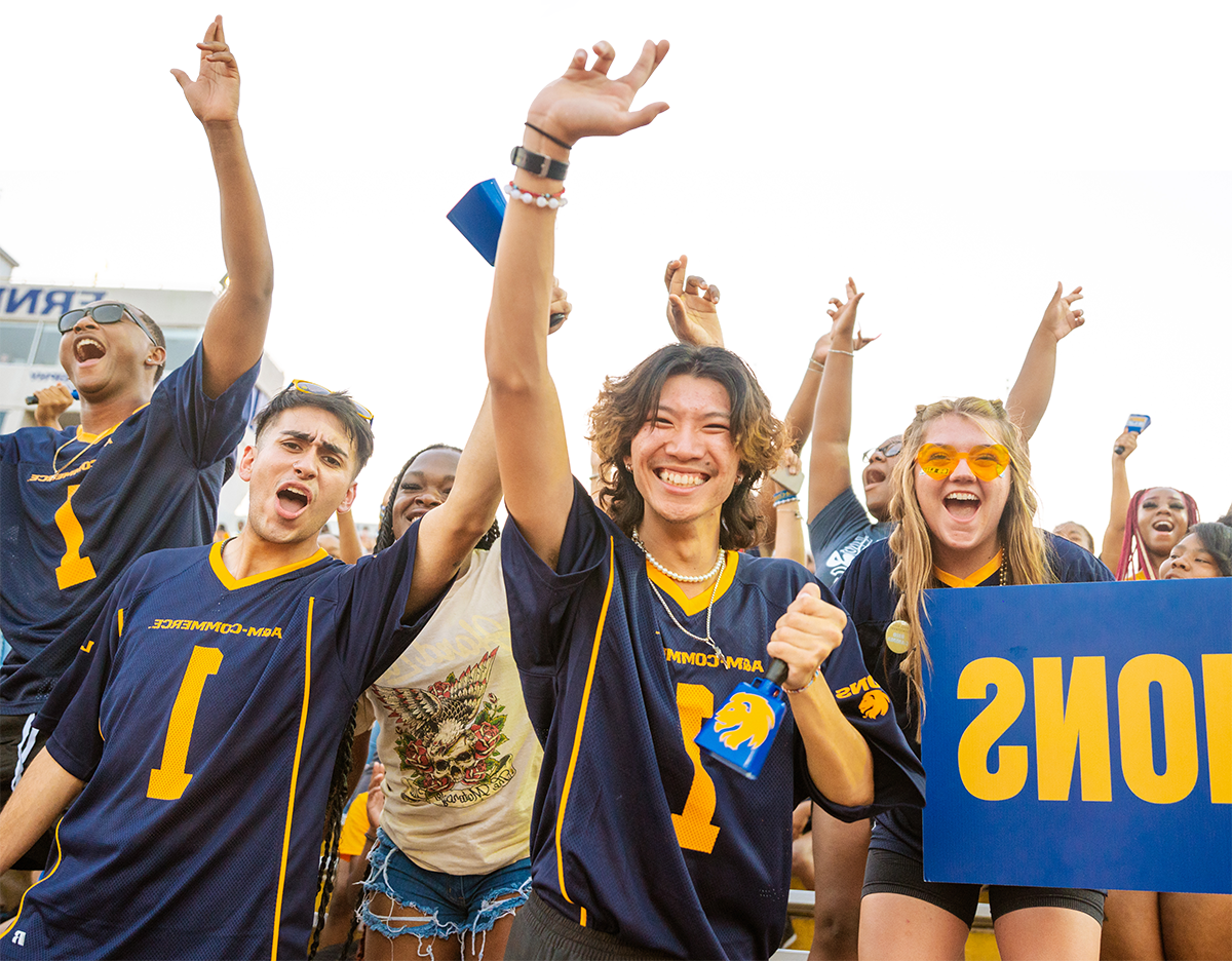 Spirited students cheering at the football stadium